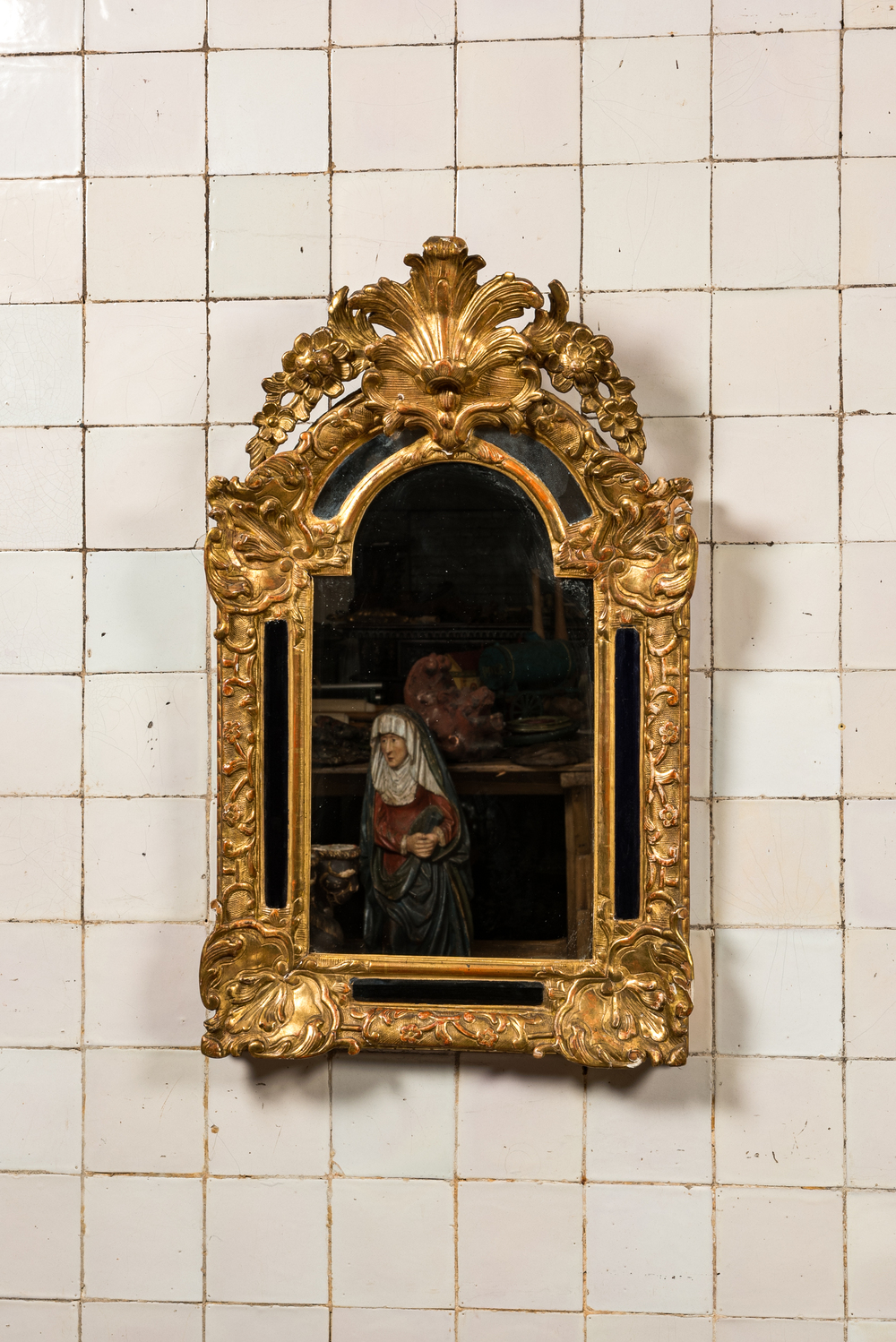 A French carved and gilt wooden Louis XV-style rocaille mirror, 19th C.