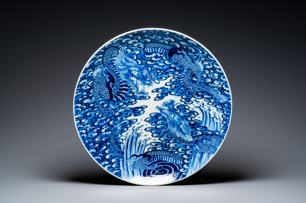 An exceptionally large Japanese blue and white Arita 'dragon' dish, 19th C.