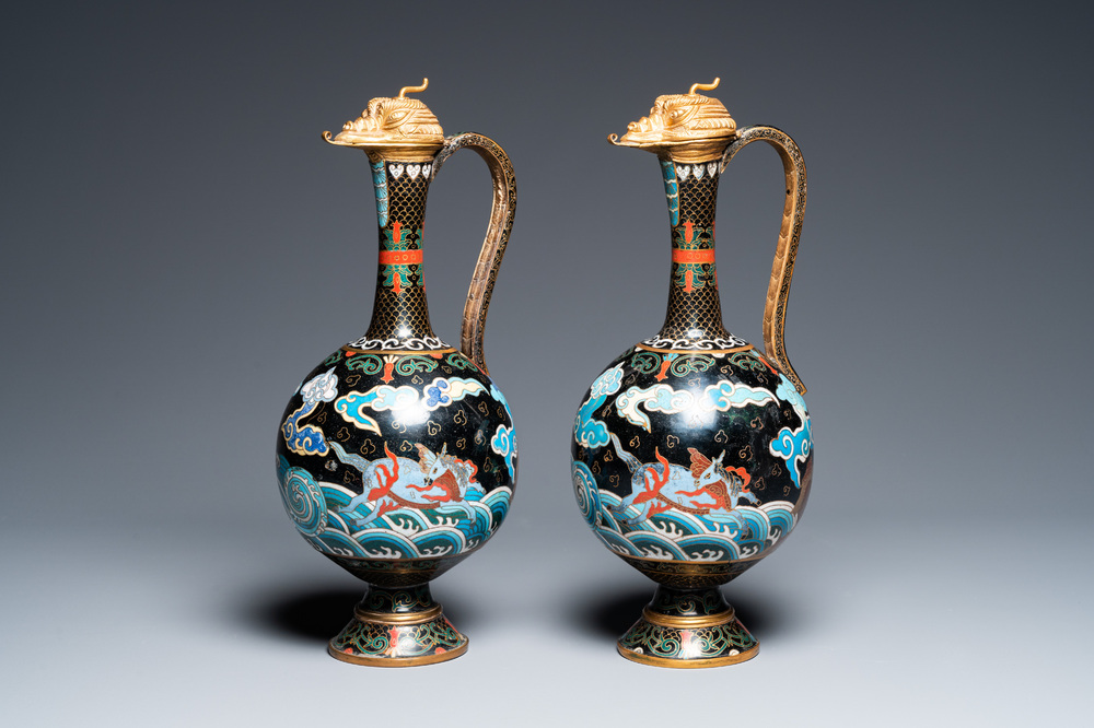 A pair of Chinese cloisonn&eacute; 'mythical beasts' ewers with zoomorph gilt covers, Qing