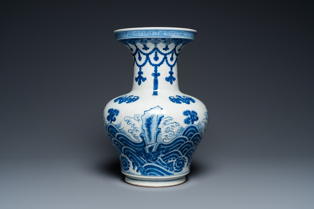 A Chinese blue and white vase with rocks in a wavy sea, Qianlong/Jiaqing