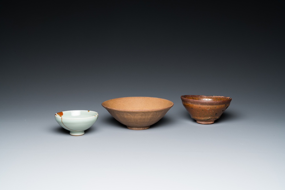 A Chinese Jian bowl, a qingbai bowl with kintsugi repair and a 'lotus' bowl, Song or later