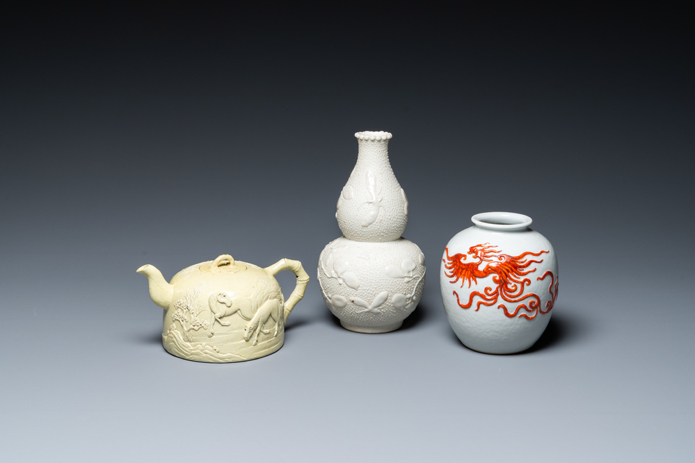 A Chinese yellow-glazed biscuit teapot, a white-glazed biscuit double gourd vase and an iron-red 'phoenix' jar, 20th C.