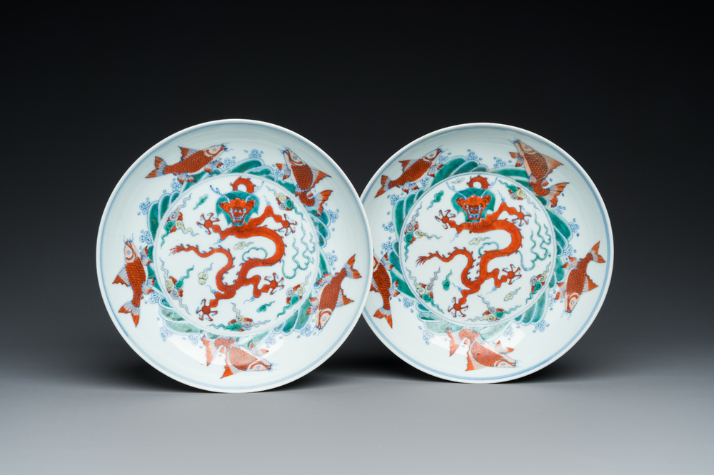 A pair of Chinese doucai 'dragon' plates, Chenghua mark, Kangxi