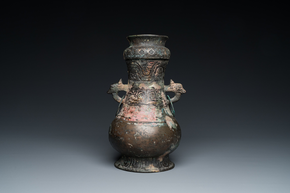 A Chinese ritual bronze 'hu' wine vessel and cover, Eastern Zhou or earlier