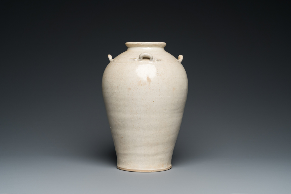 A Vietnamese white-glazed pottery vase with four ring handles, Ly 