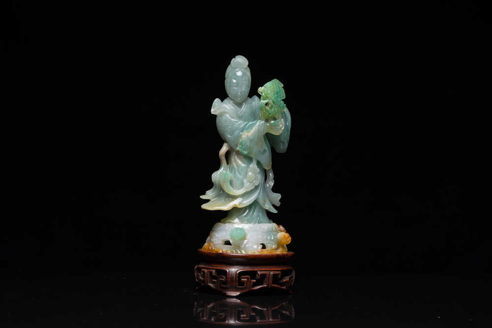 A Chinese jade sculpture of a lady on a wooden stand, Qing