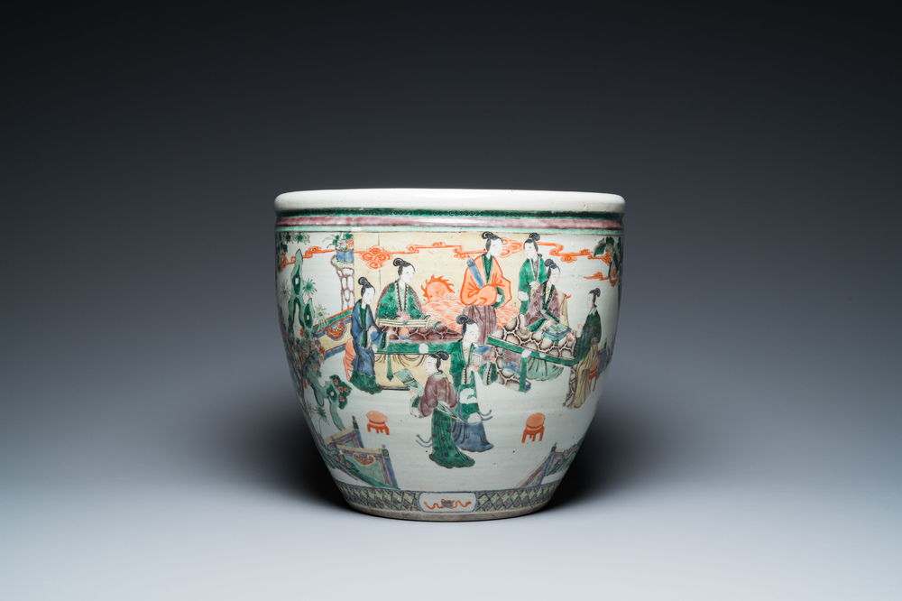 A Chinese famille verte fish bowl with female musicians in a garden, 19th C.