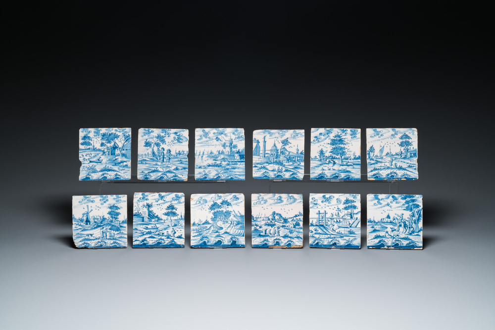 12 blue and white Dutch Delft tiles with continuous landscape scenes, 18th C.