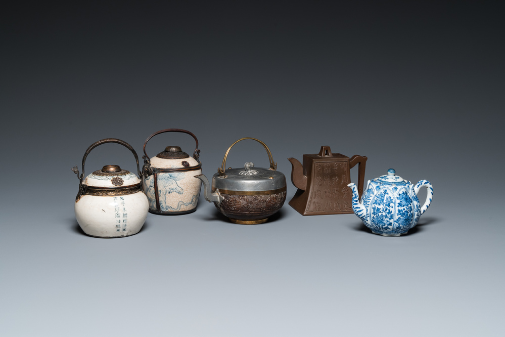 Two Vietnamese blue and white water pipes, a blue and white 'lotus' teapot, a Yixing teapot and a coconut teapot, Kangxi and later