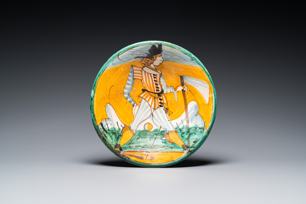 A polychrome Italian maiolica dish with a soldier, Montelupo, 17th C.