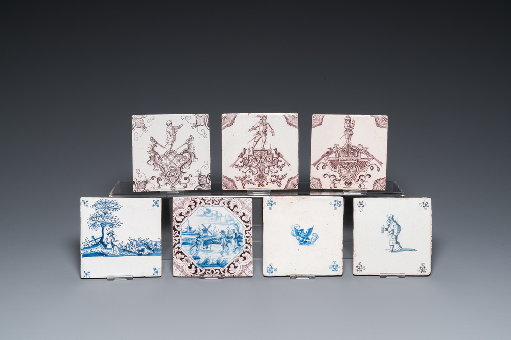 Seven Duch Delft blue and white and manganese tiles, 17/18th C.