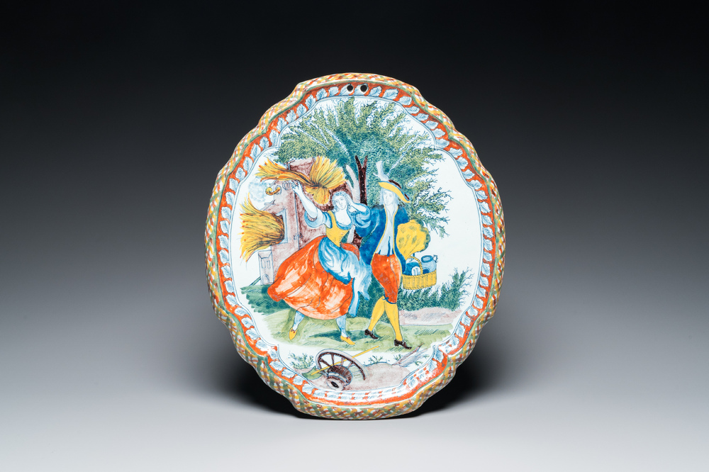 A polychrome Dutch Delft 'pastoral subject' plaque, 18/19th C.