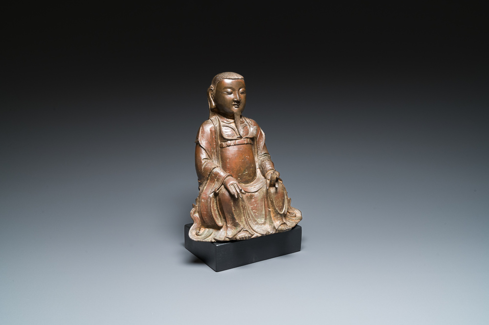 A Chinese bronze Zhen Wu with traces of red lacquer, Ming