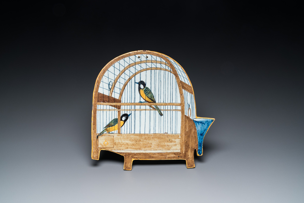 A rare polychrome Dutch Delft 'birdcage' plaque with two birds, 18th C.