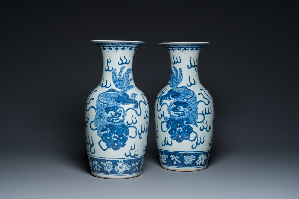 A pair of Chinese blue and white 'Buddhist lion' vases, 19th C.