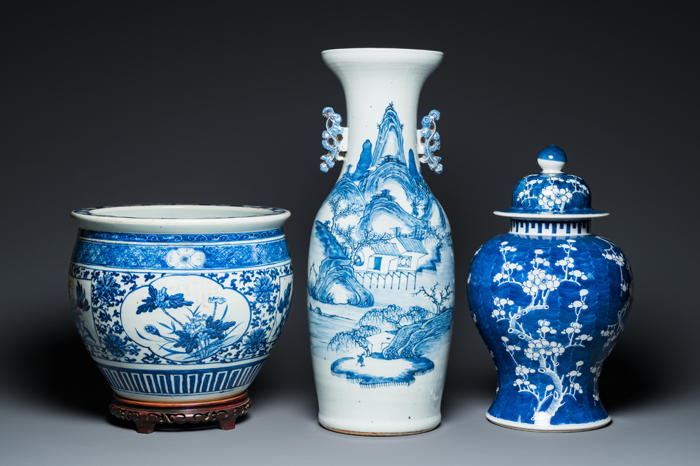 A Chinese blue and white 'landscape' vase, a covered vase and a jardini&egrave;re, 19th C.