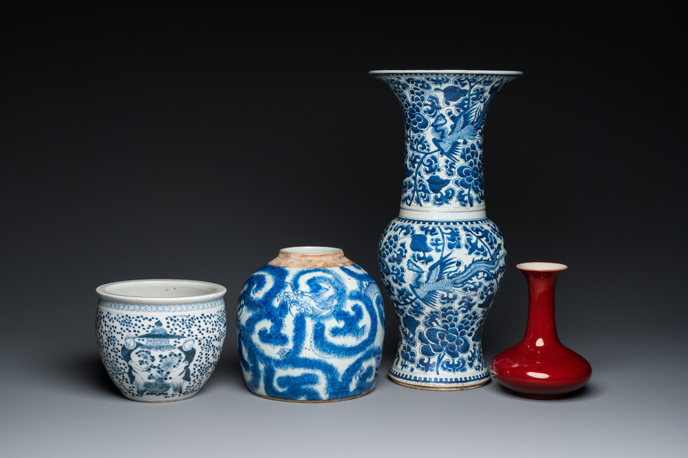 Three Chinese blue and white vases and a monochrome red vase, 19th C.