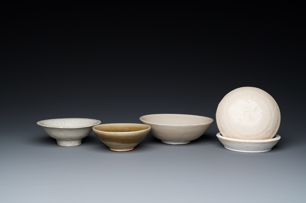 Three Chinese celadon- and qingbai-glazed bowls and a cream-glazed box and cover, Song and later