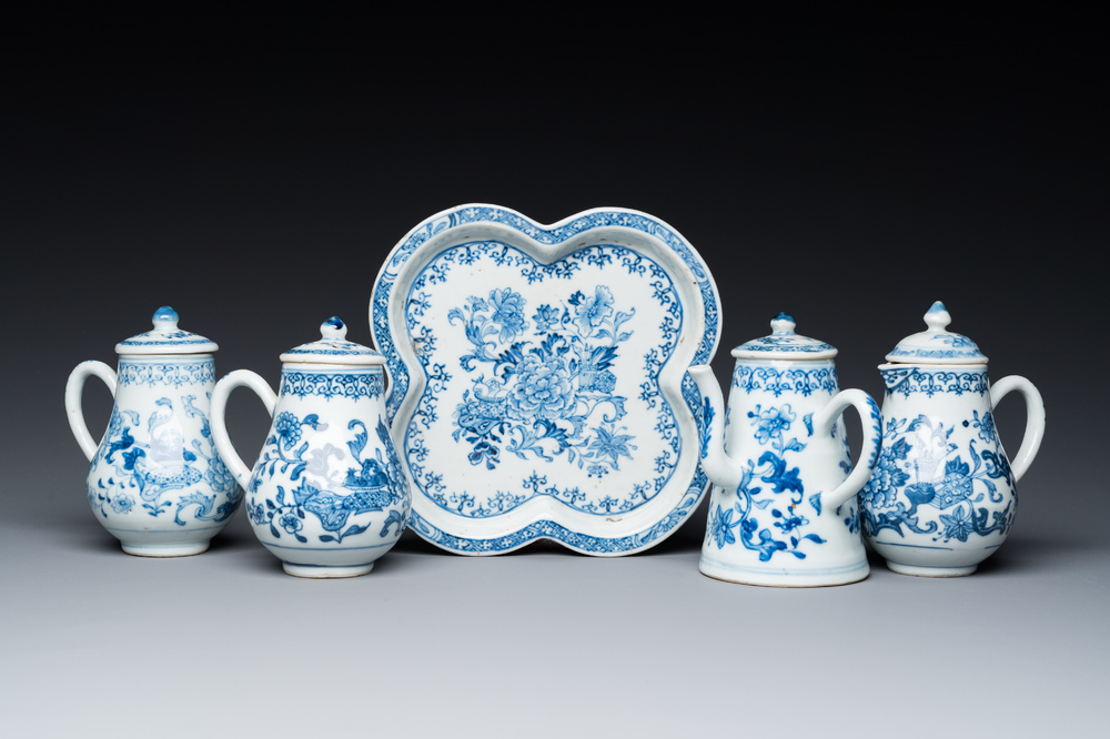 A rare Chinese blue and white set of two jugs and two casters on stand, Qianlong