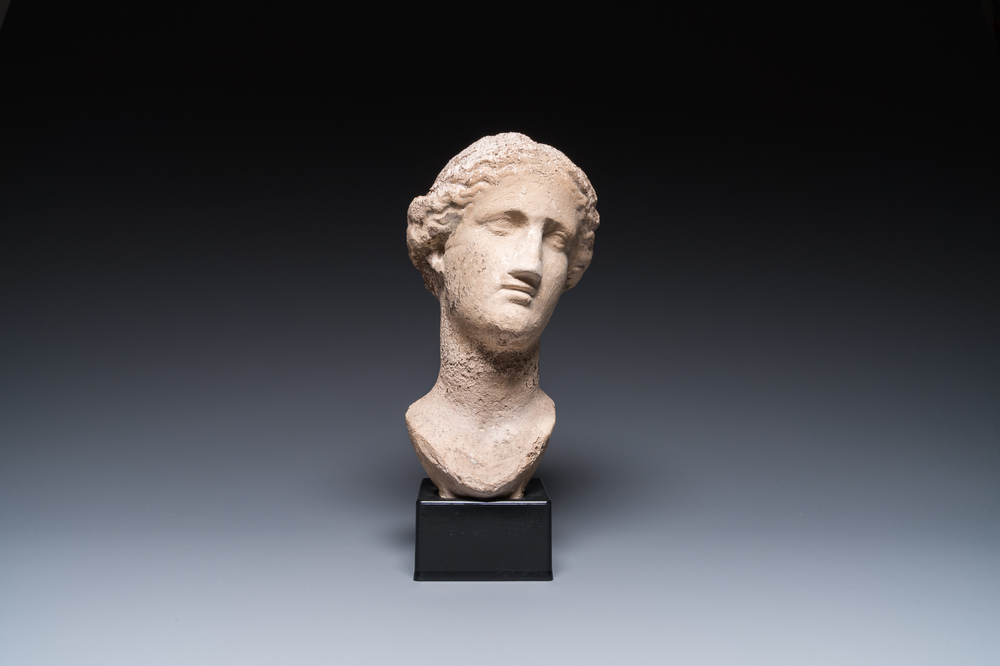 A Roman limestone head of a female, probably Pannonia province, 1st/4th C.