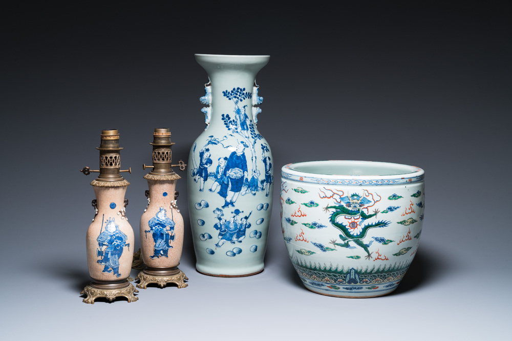 A Chinese blue and white celadon-ground vase, a pair of Nanking vases and a famille verte fish bowl, 19th C.