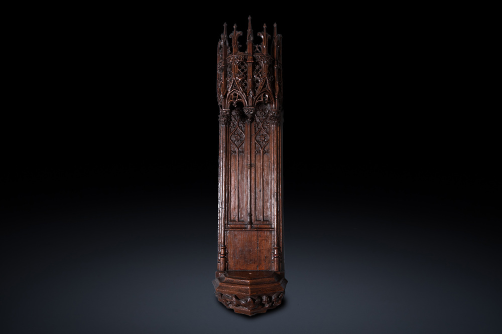 A fine carved oak niche with gothic architectural crowning, 15/16th C.