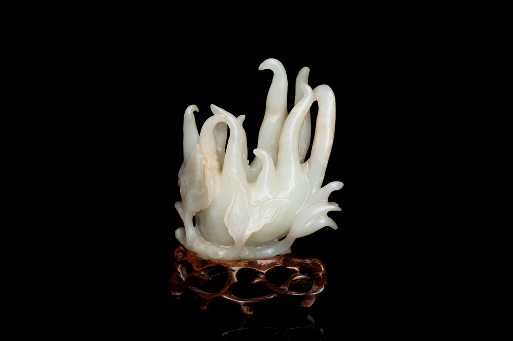 A fine Chinese white jade carving of a Buddha's hand on wooden stand, Qing