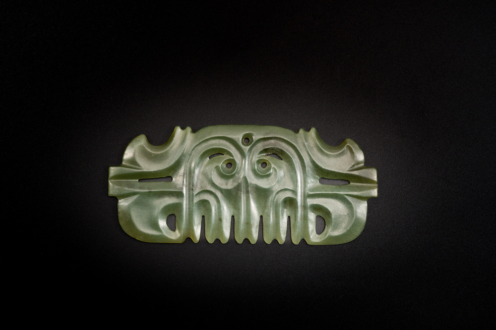 A Chinese spinach jade pendant in Hongshan-style, Qing