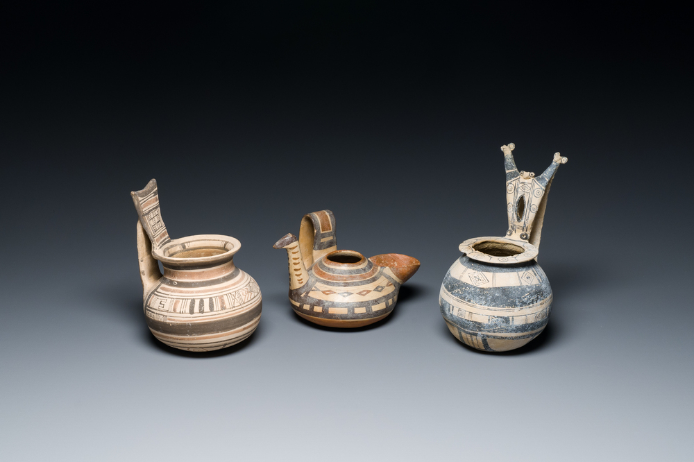 Two geometrical decorated Daunian pottery vessels and an olive press, Southern Italy, 6th/3rd C. b.C.