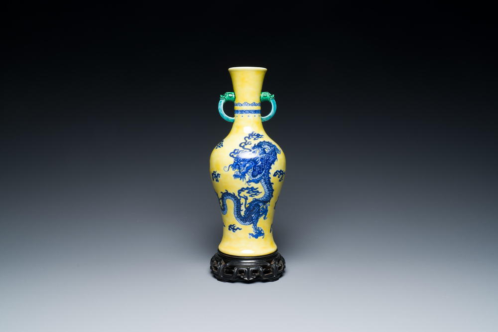 A Chinese blue and white yellow-ground 'dragon' vase with green-glazed handles on a jade-inset wooden stand, Jiaqing mark, 19/20th C.