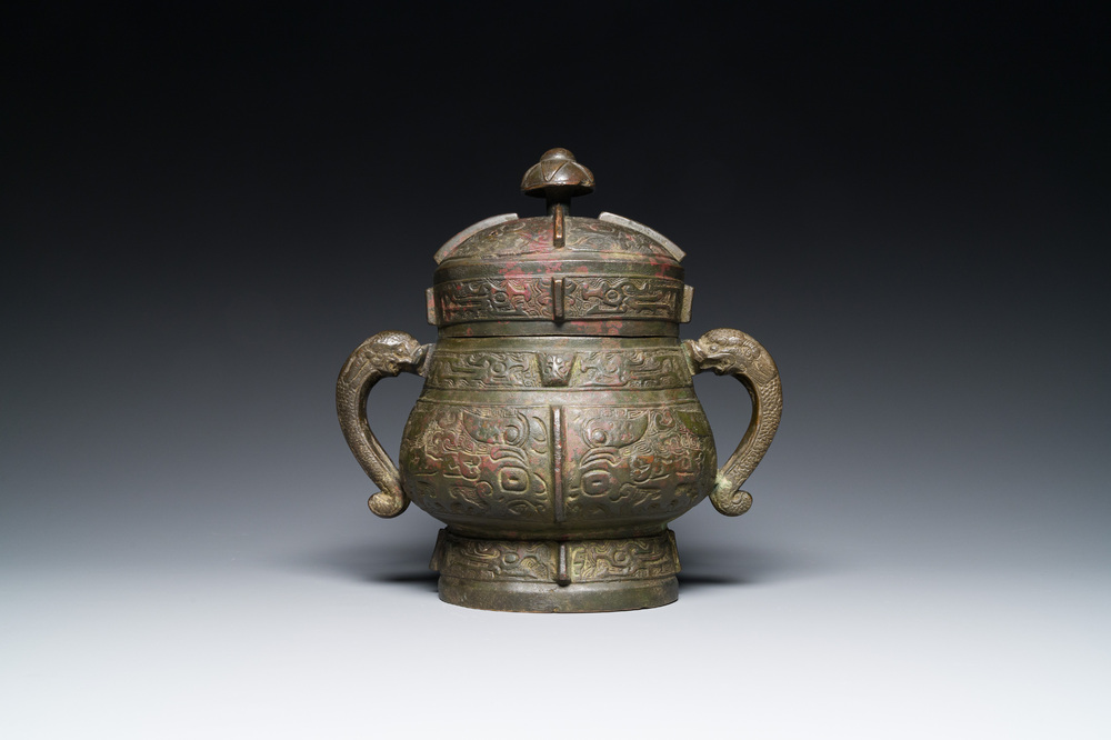 A Chinese archaic bronze ritual wine vessel and cover in Western Zhou-style, 'you', Ming