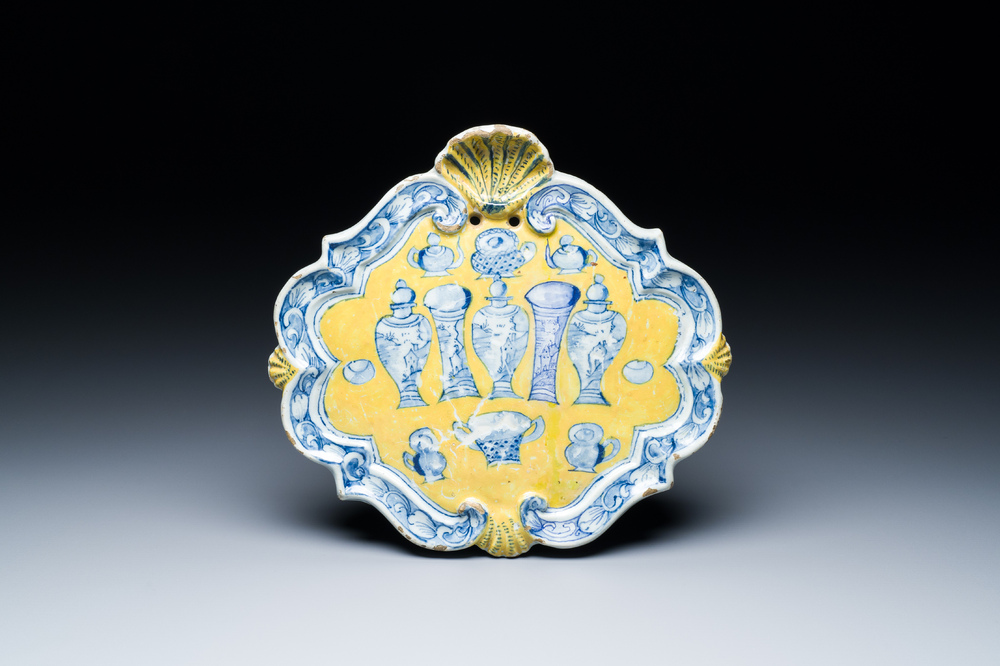 A rare Dutch Delft yellow ground 'sample' plaque, 18th C.