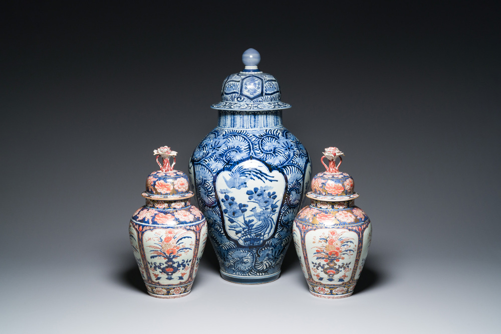 A pair of Japanese Imari vases with flower-topped covers and a large blue and white Arita vase, Edo, 17/18th C.