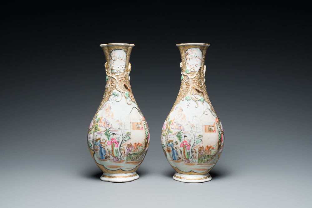 A pair of Chinese famille rose 'mandarin subject' bottle vases, Qianlong