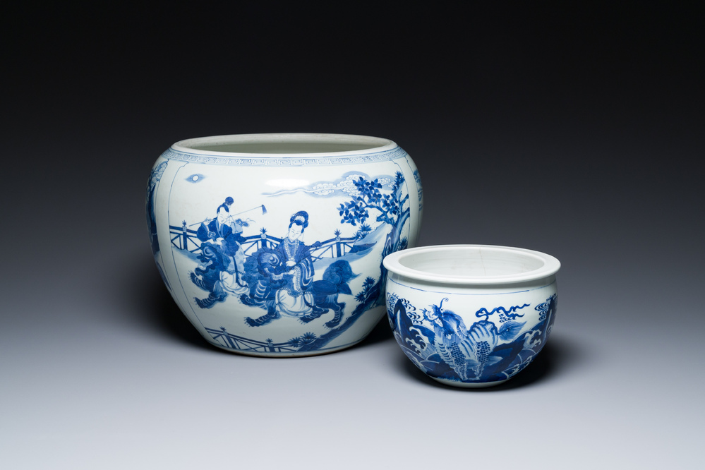 Two Chinese blue and white fish bowls or jardini&egrave;res with figurative design and mythical animals, 19/20th C.