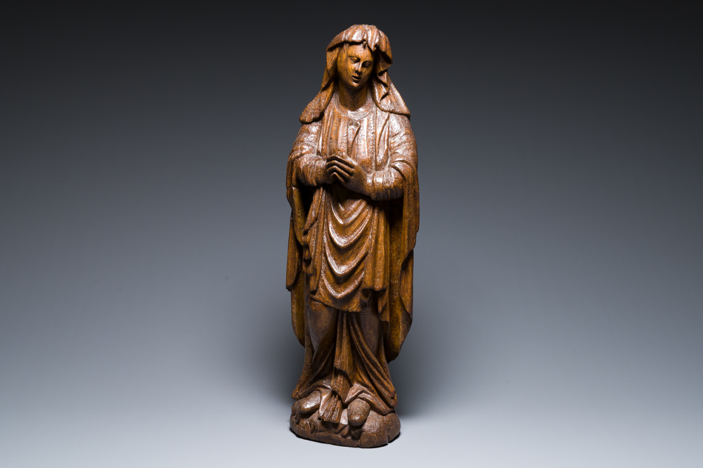 A Flemish carved oak figure of Mary Magdalen from a Crucifixion group, 16th C.