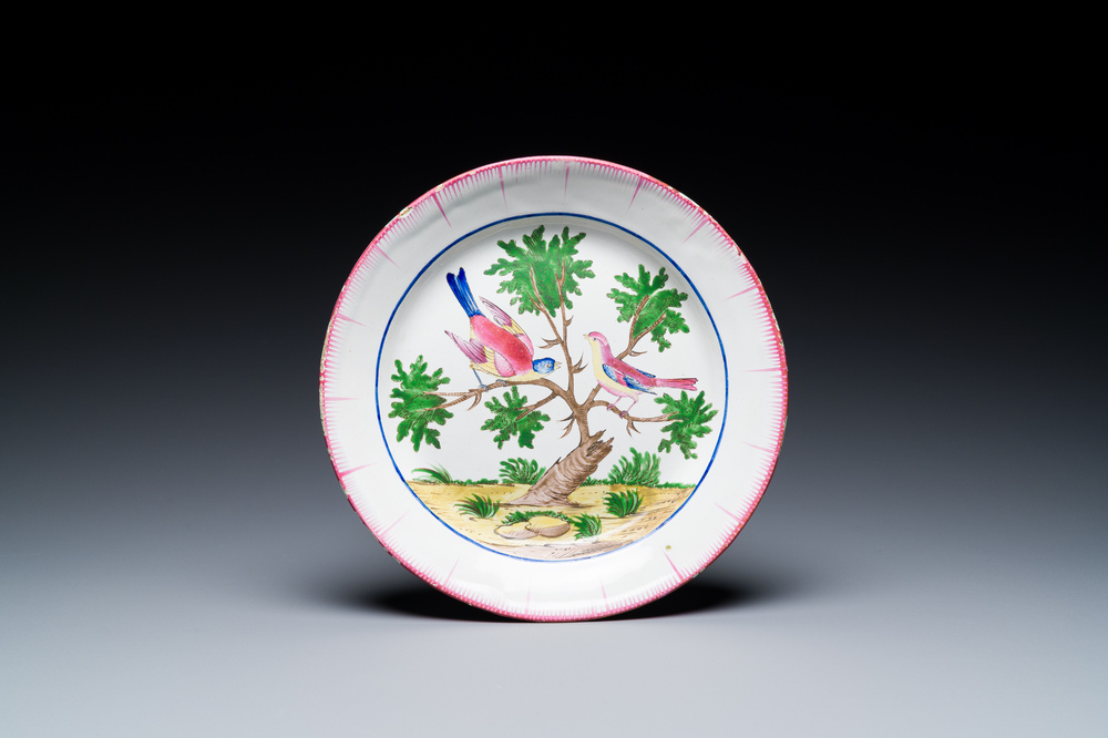 A French faience de l'Est plate with two birds in a tree, Les Islettes, Dupr&eacute; workshop, early 19th C.