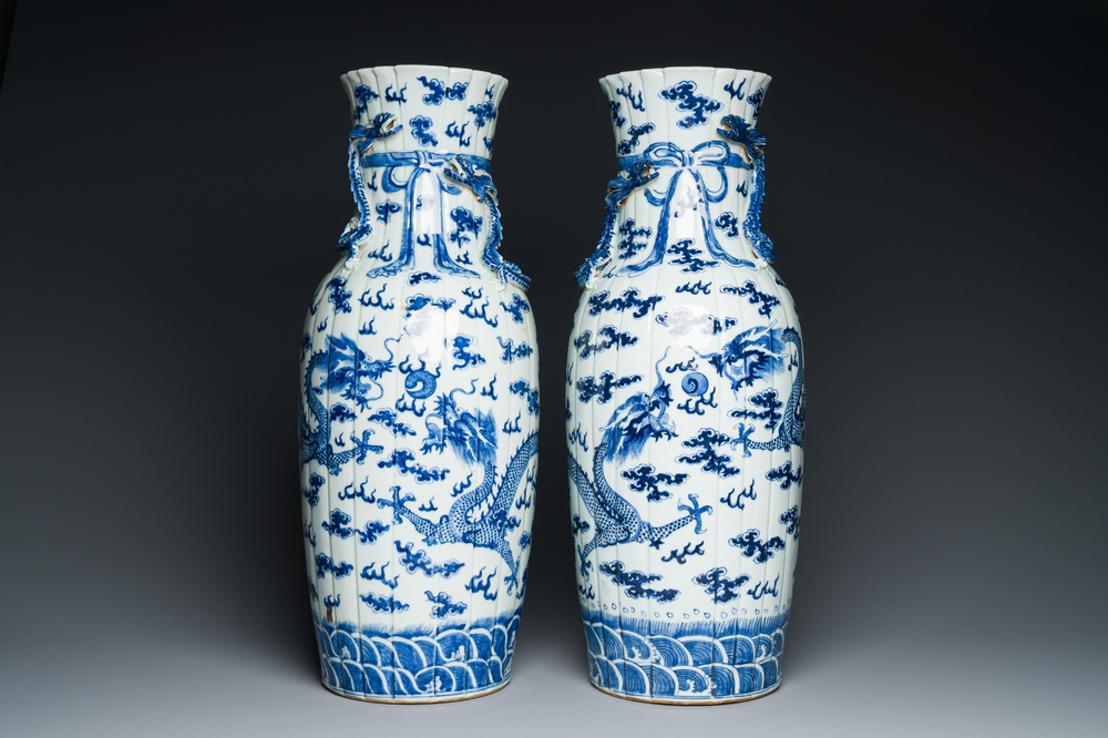 A pair of Chinese blue and white 'dragon' vases, 19th C.