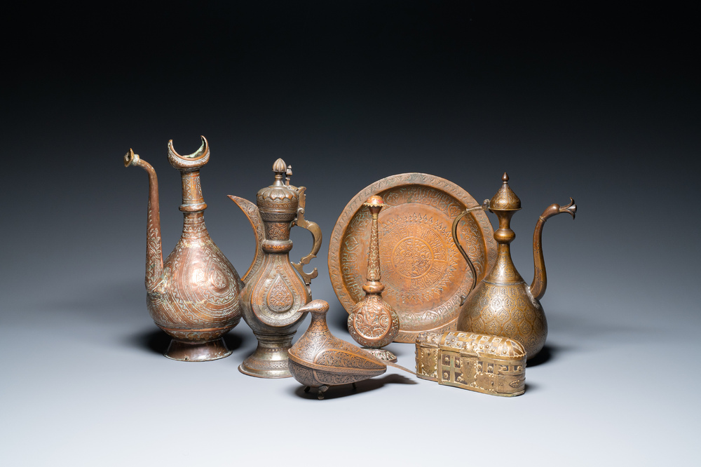 A varied collection of Islamic copper and tin utensils, 19/20th C.