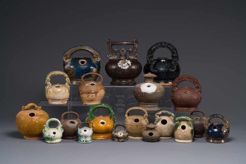 A large collection of nineteen Vietnamese stoneware lime pots, 14th C. and later