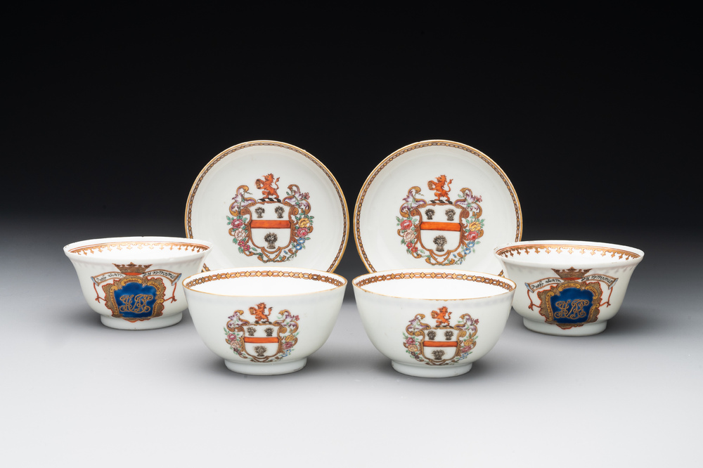 A pair of Chinese armorial famille rose cups and saucers with the arms of Tyndall for the English market and two monogrammed bowls, Qianlong