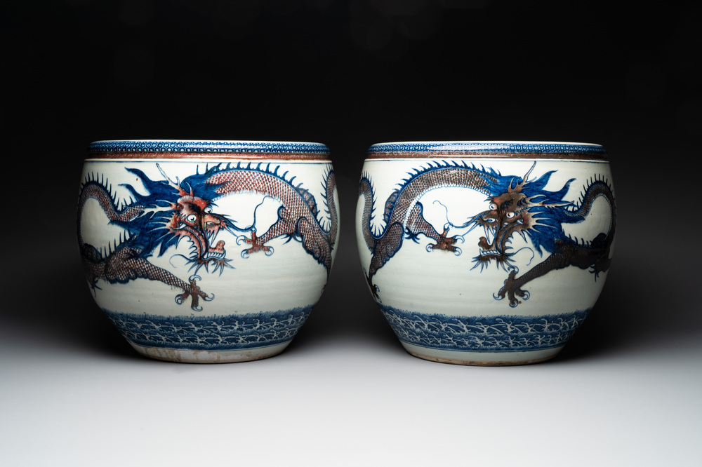 A pair of Chinese blue, white and copper-red 'dragon' fish bowls, Qianlong
