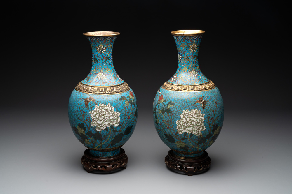 A pair of Chinese cloisonn&eacute; 'flowers and insects' vases on wooden stands, 18/19th C.