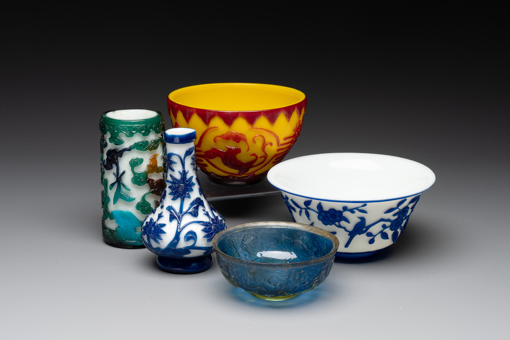 A Chinese blue-overlay white Beijing glass vase, a multi-colour brush pot and three bowls, 19th C.