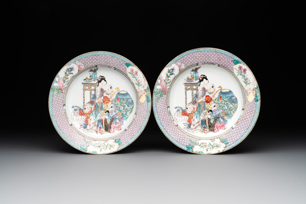 An extremely fine pair of Chinese famille rose 'ruby back' eggshell plates with a lady and playing boys, Yongzheng