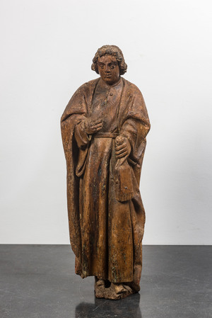 A Flemish oak figure of Saint John with traces of polychromy, 16th C.