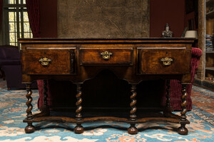 An English walnut sideboard with three drawers, 19th C.