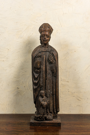 Saint Nicolas au garçon agenouillé en bois sculpté, 17ème
