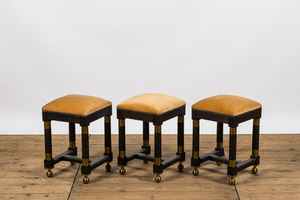 Three square black painted brass mounted wooden stools, 20th C.