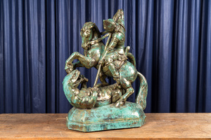Sculpture en faïence à patine faux bronze figurant Saint Georges terrassant le dragon, milieu du 20ème